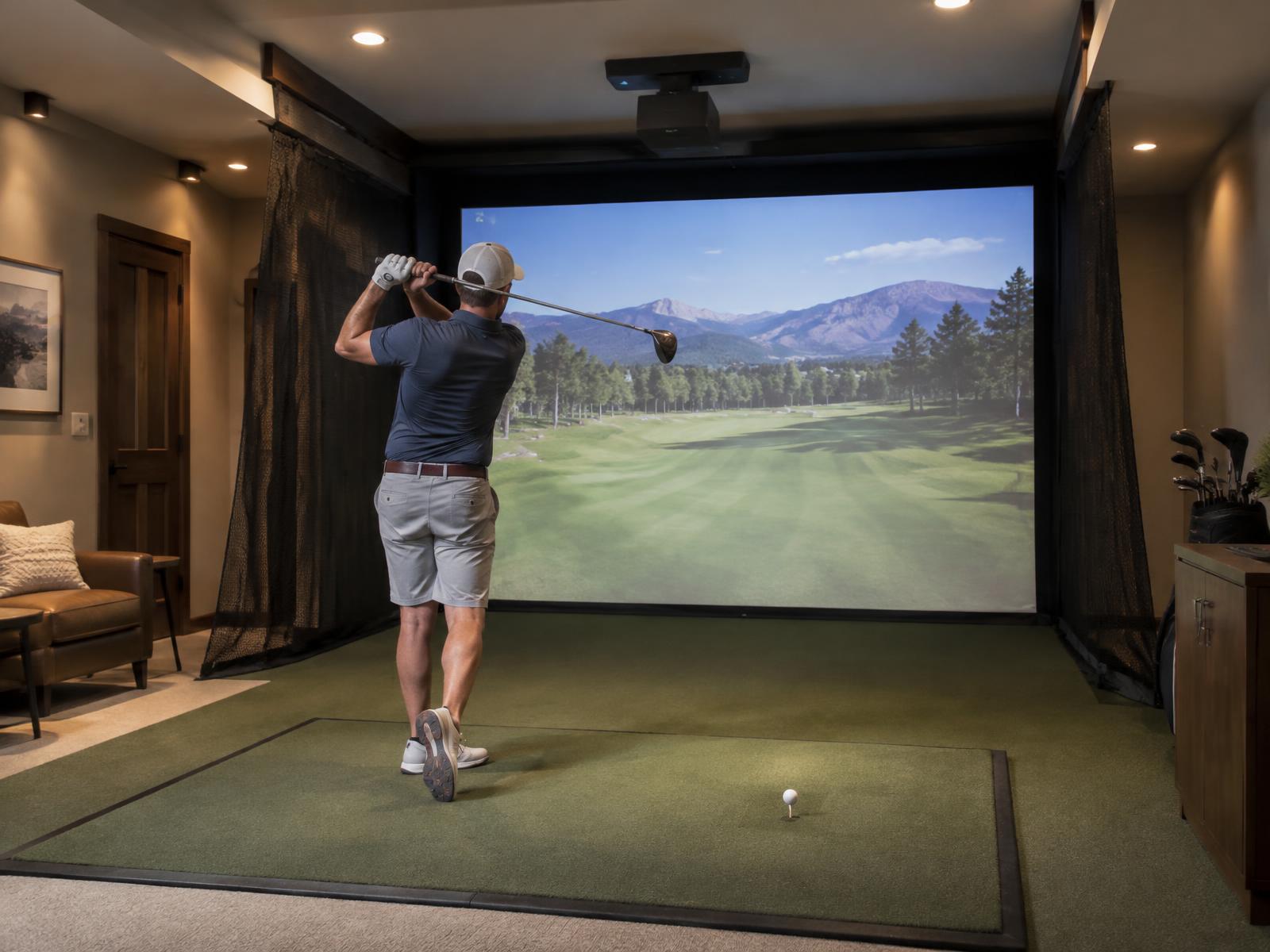 Golfer mid-swing on a turf hitting mat in front of a simulator impact screen